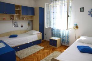 Säng eller sängar i ett rum på Vacation House on island Brac - Ana