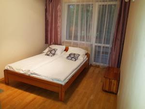 Posteľ alebo postele v izbe v ubytovaní Apartamenty i Pokoje przy Parku