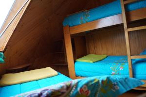 Postel nebo postele na pokoji v ubytování Cabañas Domos May-Ling