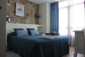 Giường trong phòng chung tại Casa da Balea