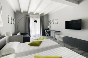Postel nebo postele na pokoji v ubytování Ca' Barbini Resort