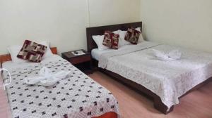Una cama o camas en una habitación de Hotel Sisters Home