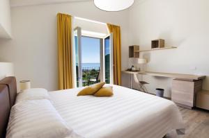 Postel nebo postele na pokoji v ubytování Ca' Barbini Resort