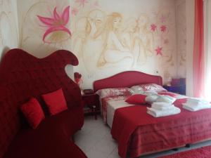 Postel nebo postele na pokoji v ubytování Hotel Julia