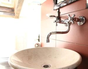 a sink in a bathroom with a faucet at Villa Jovan in Ohrid
