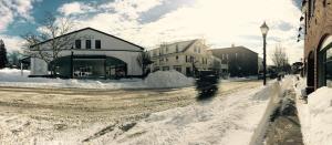 a street covered in snow with buildings and houses at The Kennebunk Inn in Kennebunk