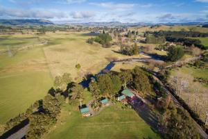 an aerial view of a large field with a golf course at The River Lodge in Ohakune