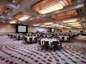 a large room with tables and chairs in a hall at Hyatt Regency Cincinnati in Cincinnati