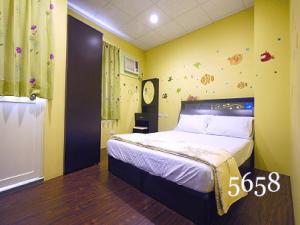 Кровать или кровати в номере Hua Qiao De Jia