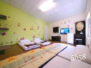 Voodi või voodid majutusasutuse Hua Qiao De Jia toas