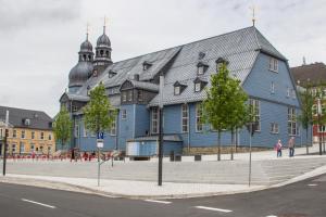a large blue building on the side of a street at Selke´s exklusives Ferienhaus in Clausthal-Zellerfeld