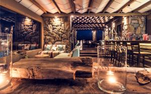 a room with a large wooden log on a table at Keros Blue - Luxury in Wilderness in Kalliópi
