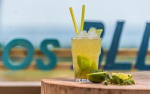 a drink sitting on top of a wooden table at Keros Blue - Luxury in Wilderness in Kalliópi