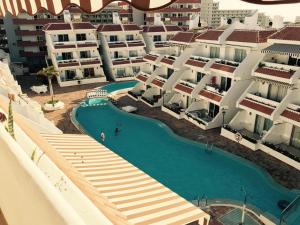 an aerial view of a resort with a swimming pool at Apartments Las Floritas in Playa de las Americas