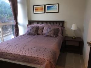 Llit o llits en una habitació de Boracay Oceanway Residences - Island Paradise