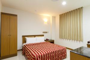 Postel nebo postele na pokoji v ubytování Songshan Hotel
