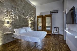 Postel nebo postele na pokoji v ubytování Muragie del Castello B&B