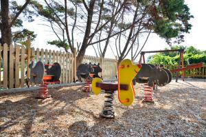 a park with a playground with a skateboard on it at Astir Of Naxos in Naxos Chora