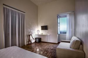 Postel nebo postele na pokoji v ubytování Muragie del Castello B&B