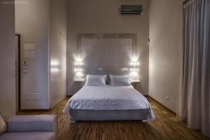 Postel nebo postele na pokoji v ubytování Muragie del Castello B&B