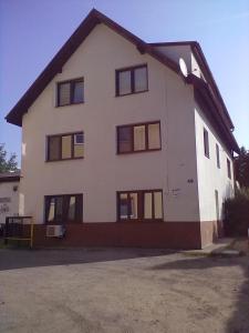 a large white house with a lot of windows at Apartment Hlinská in České Budějovice