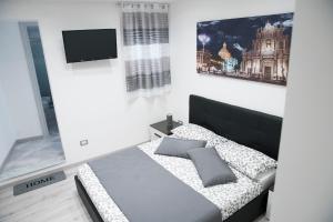 Ένα ή περισσότερα κρεβάτια σε δωμάτιο στο Tourist's home