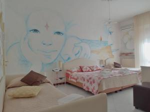 Postel nebo postele na pokoji v ubytování Hotel Julia