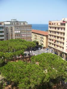 a view of a city with buildings and trees at Affittacamere Stella Marina in Piombino