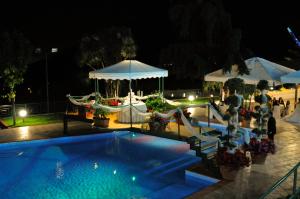 a swimming pool at a resort at night at Hotel Angela e Vincenzo in Cava deʼ Tirreni