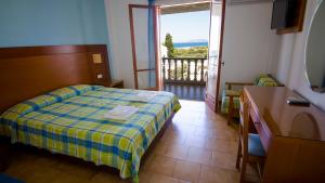 Postel nebo postele na pokoji v ubytování Hotel Navarone
