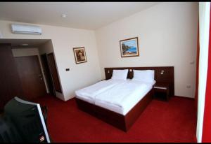 Posteľ alebo postele v izbe v ubytovaní Lux Hotel Pansion