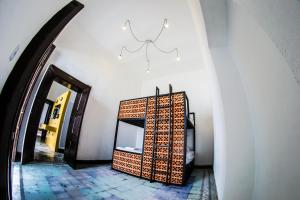 a hallway with a room with a door and a mirror at Gente de Más Bnb in Puebla