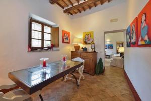 a living room with a table and a living room at Alberto Charming Home in Montepulciano