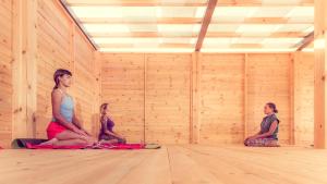 a group of three women sitting in a room at Keros Blue - Luxury in Wilderness in Kalliópi