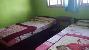 Postel nebo postele na pokoji v ubytování Sedulur Homestay + 13 fotografií