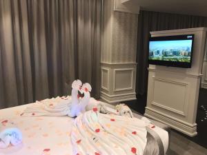 Llit o llits en una habitació de Aswar Boutique Hotel