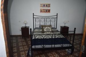 A bed or beds in a room at Holiday Home El Brezal