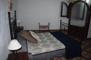 A bed or beds in a room at Holiday Home El Brezal