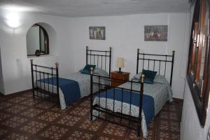 A bed or beds in a room at Holiday Home El Brezal