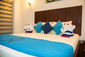 A bed or beds in a room at Anantamaa Hotel