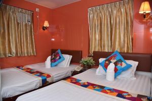 Katil atau katil-katil dalam bilik di Traveller's Hostel