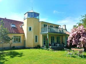 a large house with a tower on top of it at Fiskargränd 5 in Visby