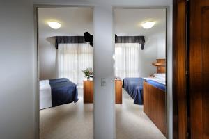 Postel nebo postele na pokoji v ubytování Hotel Vina De Mar