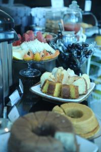 a buffet of different types of bread and pastries at Bellonorte Hotel in Altamira +24 photos