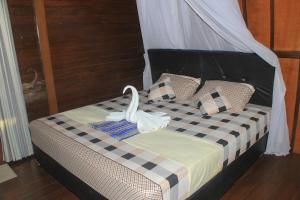 Postel nebo postele na pokoji v ubytování Bronze Bungalows