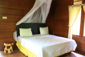 Postel nebo postele na pokoji v ubytování Bronze Bungalows