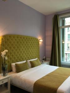 Posteľ alebo postele v izbe v ubytovaní Hotel Ginebra