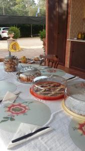 a table with plates of food on top of it at Casale Del Borgo in Hermada