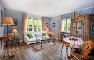 a living room with a couch and a table at Villa Wilhelmine in Oberperfuss