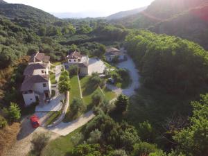 an aerial view of a house and a river at Piges Hotel in Gliki